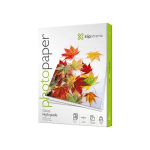 Box of Klipxtreme glossy photo paper featuring an autumn leaf collage on the cover, angled to show the product packaging